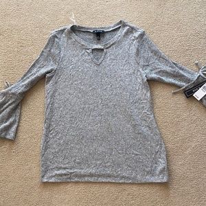 grey soft sweater with detailed flared arms